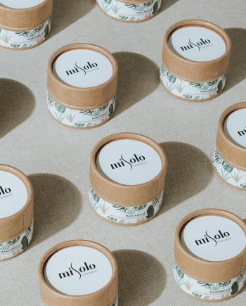 Patterned display of eco-friendly cosmetic jars highlighting sustainable beauty packaging.